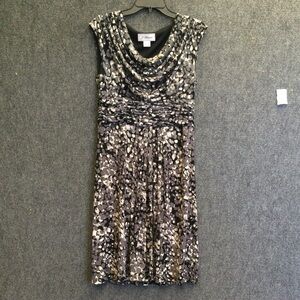 Flattering sleeveless fitted, side zip, lined jersey DRESS.  Draped neckline.